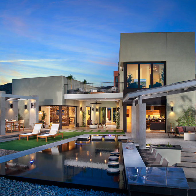 Pardee Homes Las Vegas community pool lit up at twilight