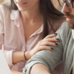 Millennial couple consulting about home design project in architect office
